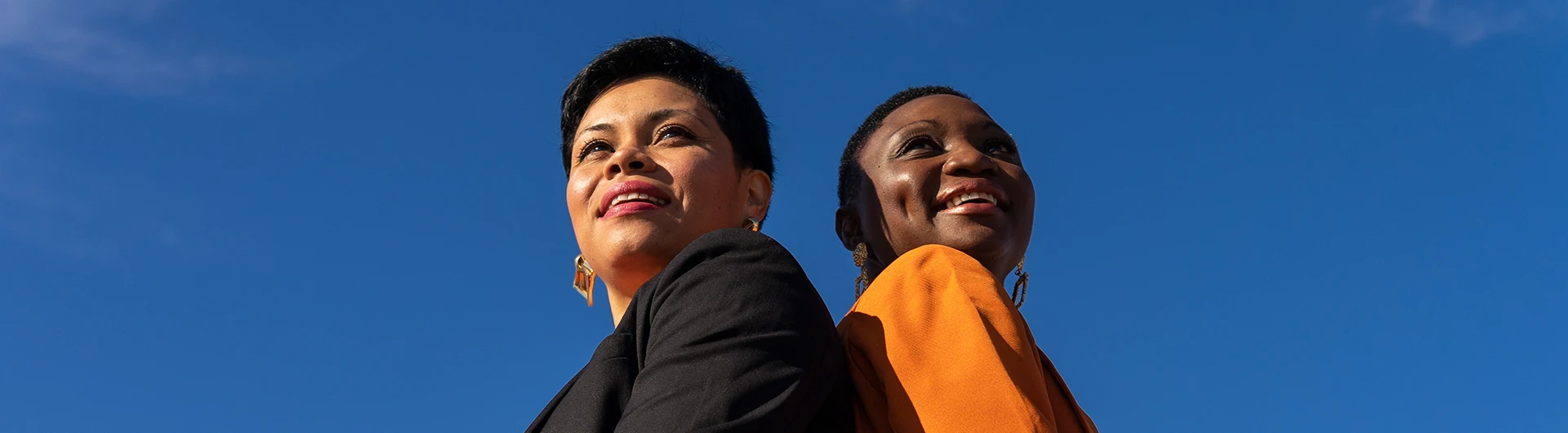 Two women with a blue sky background (photo)