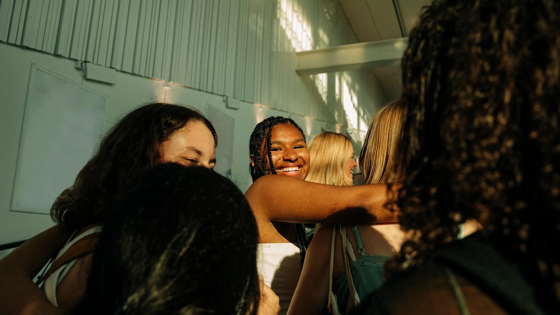 A joyful group hug, capturing connection, inclusion, and shared belonging. (photo)